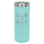 Teal powder-coated 22 oz. skinny tumbler with a stainless steel rim and clear slider lid, shown with a sample engraving