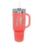 Coral powder-coated 40 oz. travel mug with a handle, straw and snap lid, shown with a sample engraving