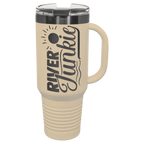 Warm sand 40 oz. travel mug with a ghost black plated band, handle and straw