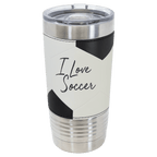 Soccer-ball-finish 20 oz. sports tumbler, white with black panels, stainless steel rim and clear slider lid, shown with a sample engraving