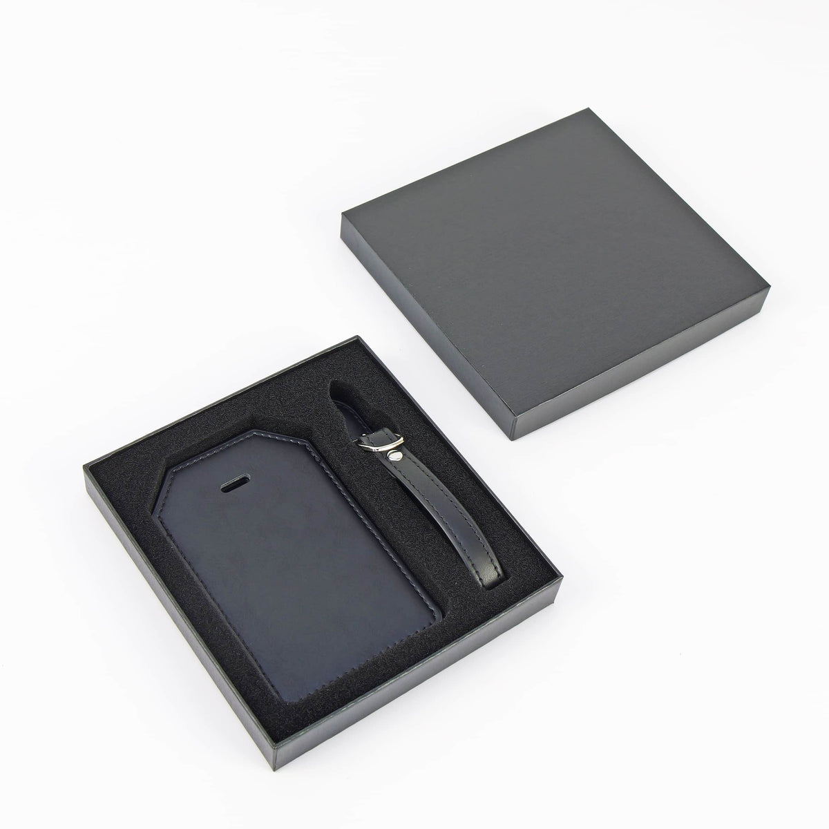 Black leatherette luggage tag with stitched edges — custom engraved luggage tag by Solano Laser Craft
