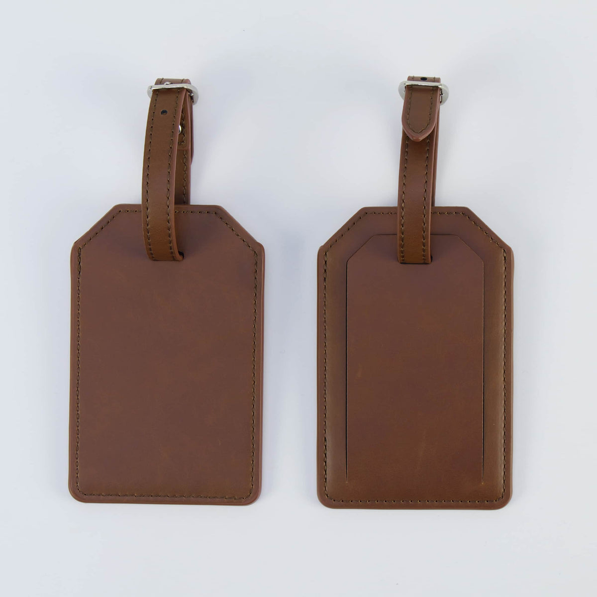 Brown leatherette luggage tag, front and back, with buckle strap