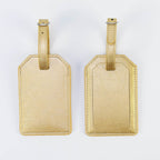 Metallic gold leatherette luggage tag, front and back, with buckle strap