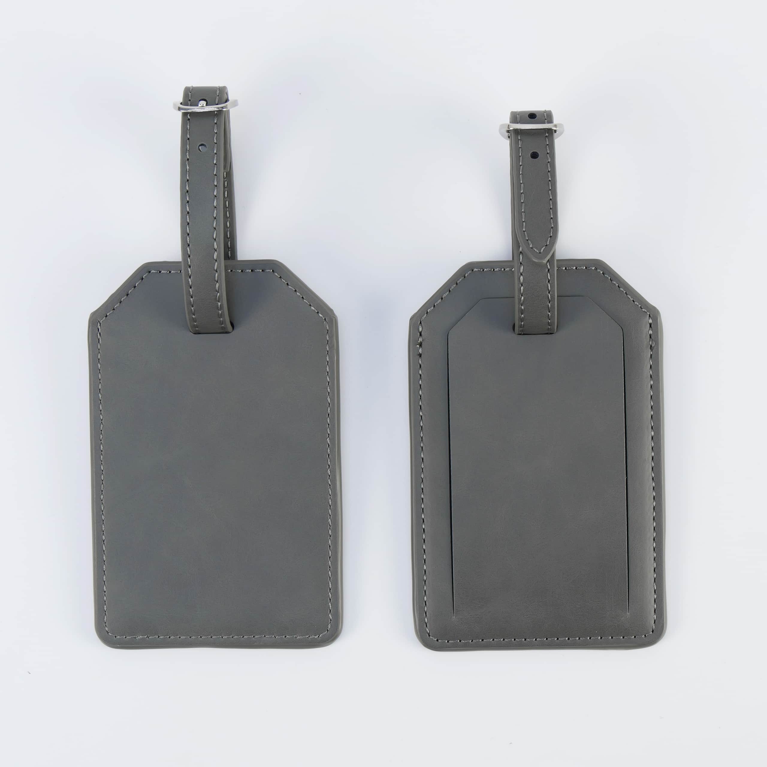 Gray leatherette luggage tag, front and back, with buckle strap