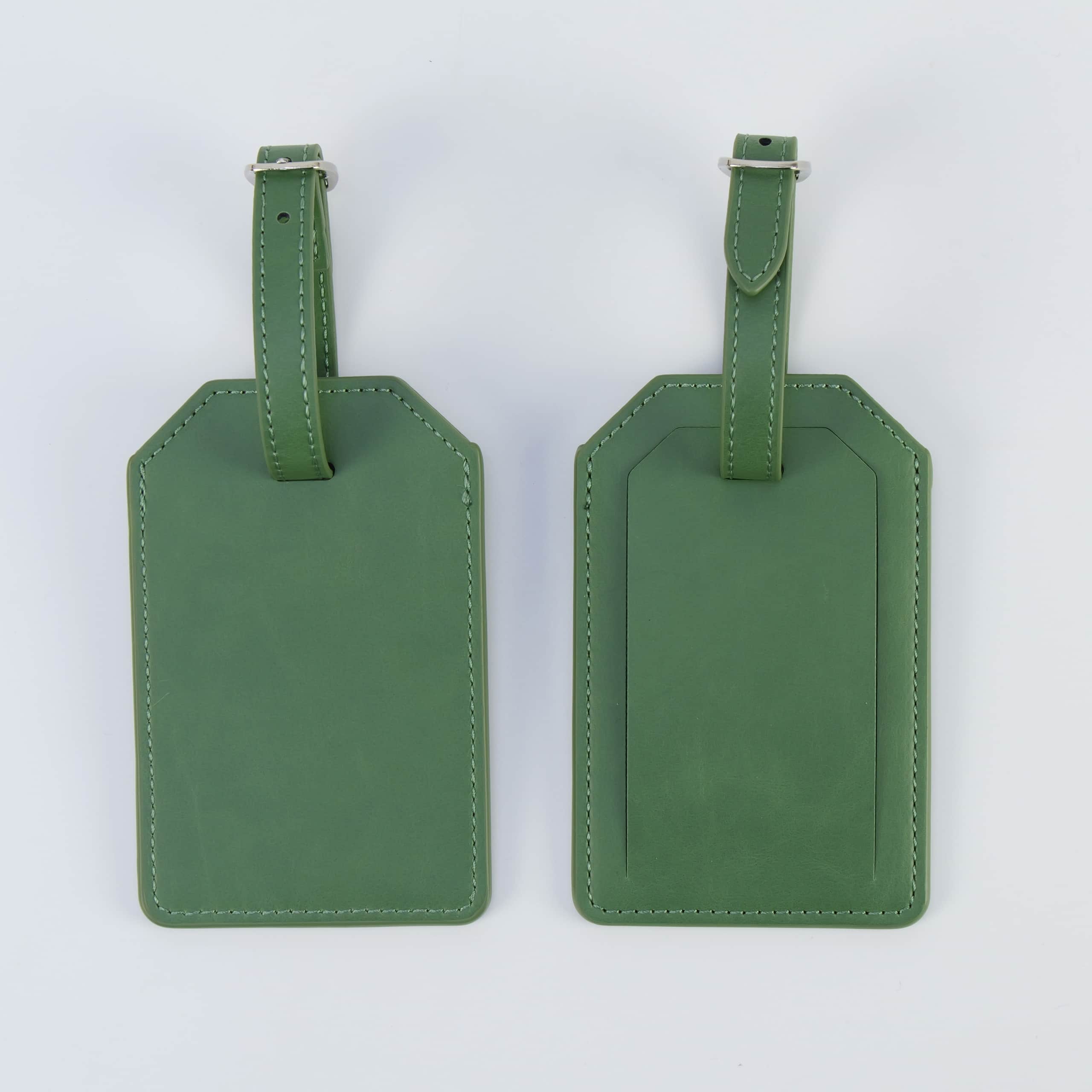 Sage green leatherette luggage tag, front and back, with buckle strap