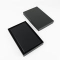 Black leatherette journal in its open black gift box