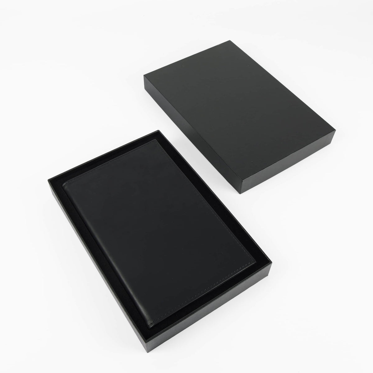 Black leatherette journal in its open black gift box
