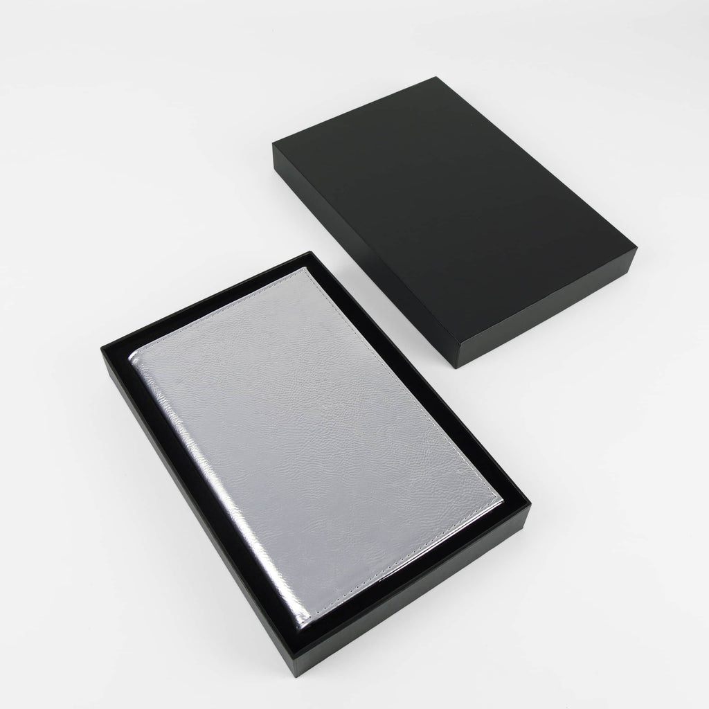 Metallic silver leatherette journal in its open black gift box