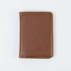 Brown leatherette passport wallet, closed front view