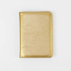 Metallic gold leatherette passport wallet, closed front view
