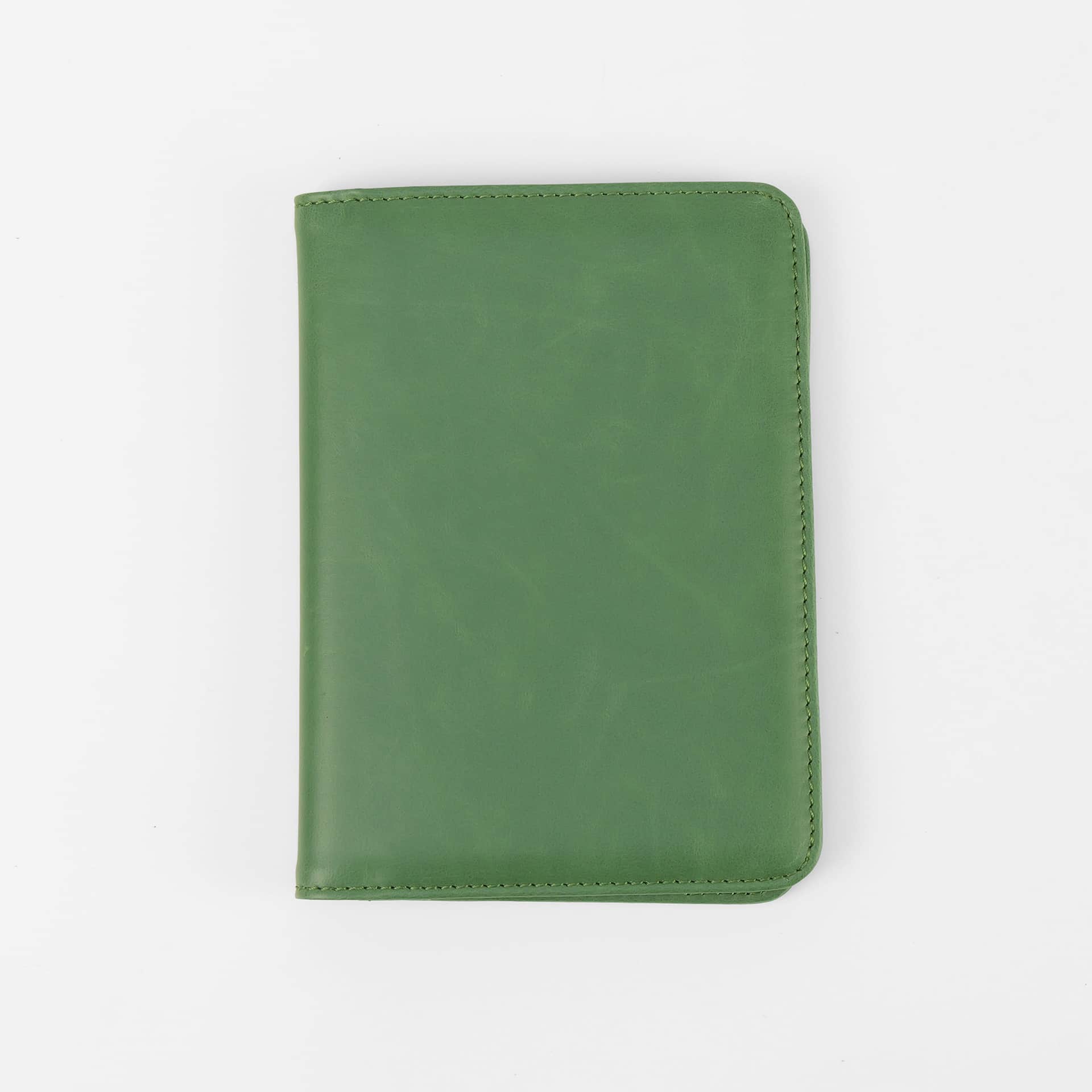 Sage green leatherette passport wallet, closed front view