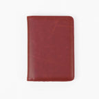 Red leatherette passport wallet, closed front view