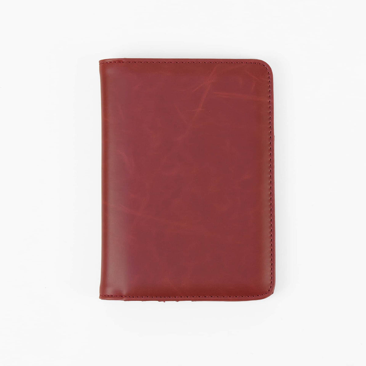 Red leatherette passport wallet, closed front view