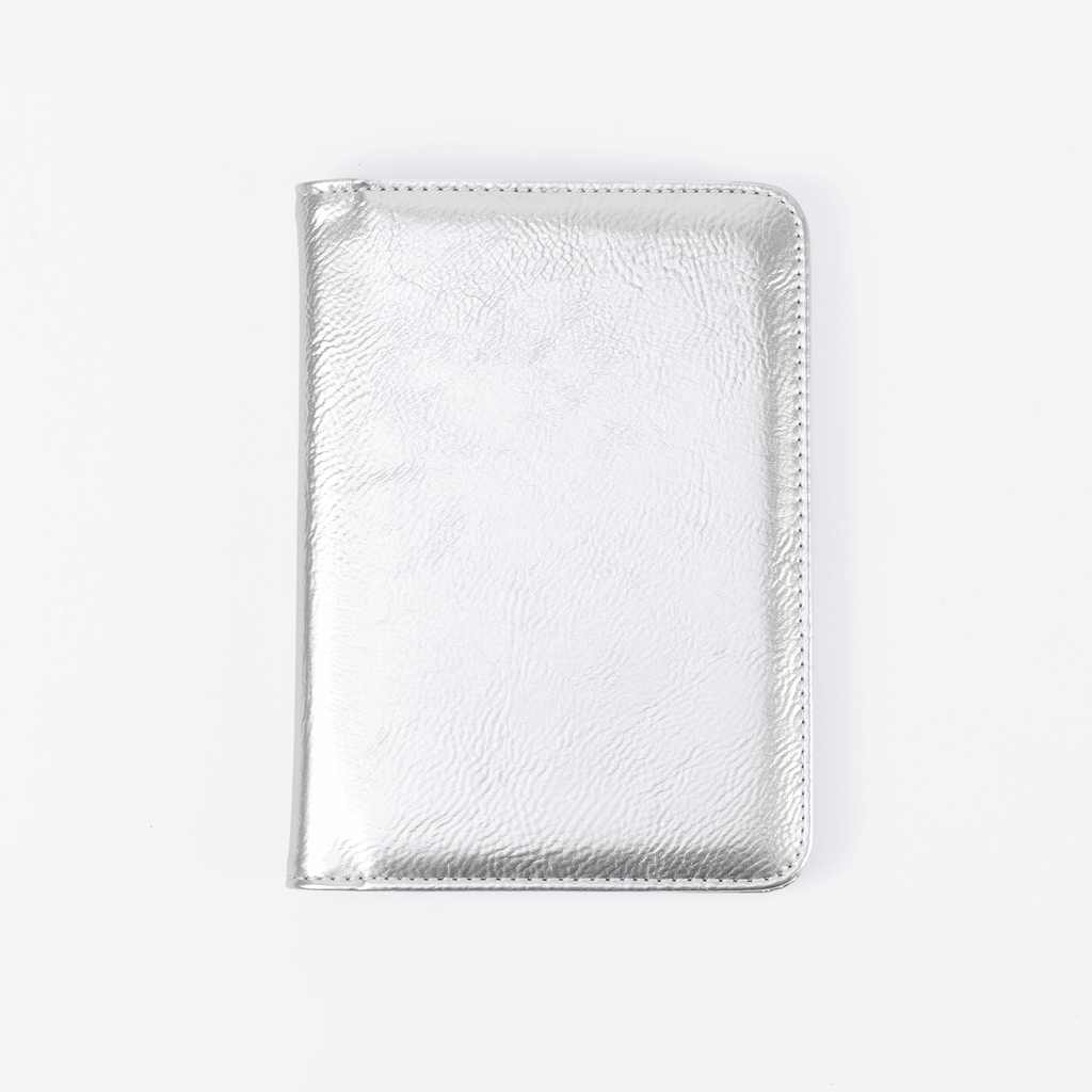 Metallic silver leatherette passport wallet, closed front view