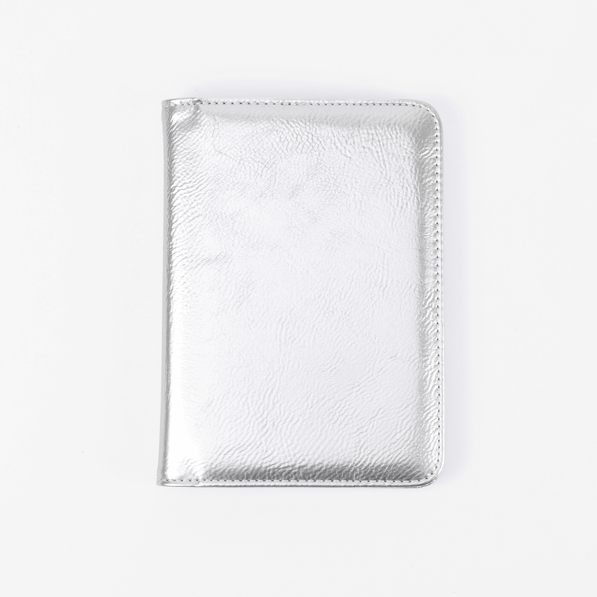 Metallic silver leatherette passport wallet, closed front view