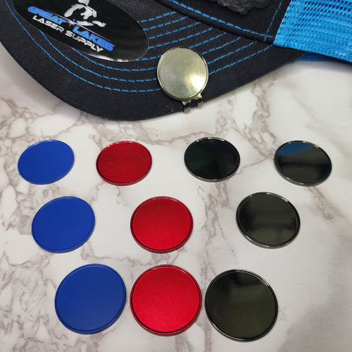 Golf ball markers in black, blue and red