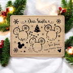Maple 12 by 9 inch Santa treat tray engraved with a Dear Santa message, mouse-ear silhouettes and a Christmas tree, staged with garland and ornaments