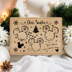 Maple 14 by 10 inch Santa treat tray engraved with a Dear Santa message, mouse-ear silhouettes and a Christmas tree, staged with garland and ornaments