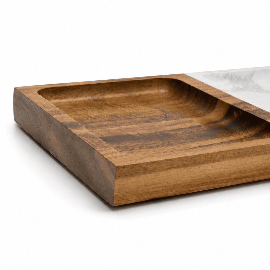 Close view of the acacia wood half of the valet tray showing the depth of the recessed compartment and the natural grain