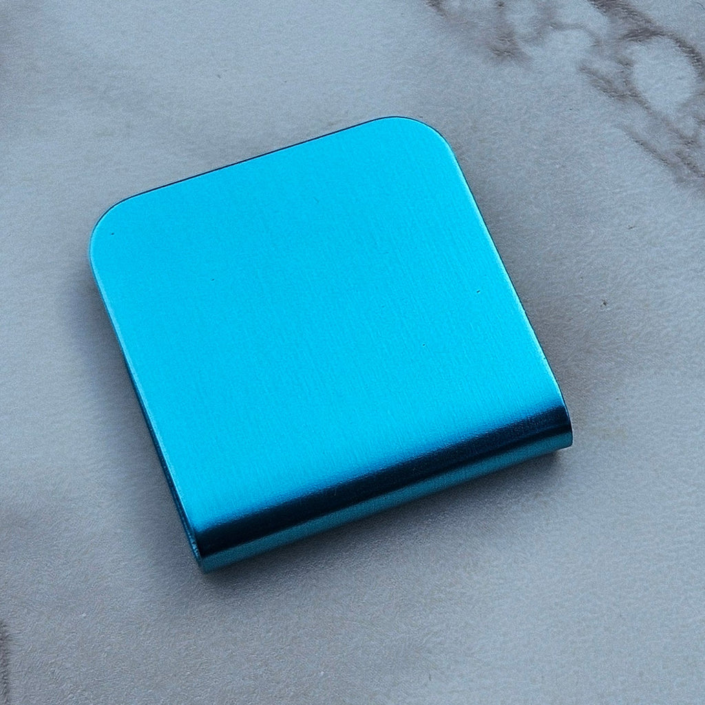 Light blue magnetic hat clip with a removable golf ball marker