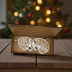 The six engraved carol ornaments nested inside their wooden gift box