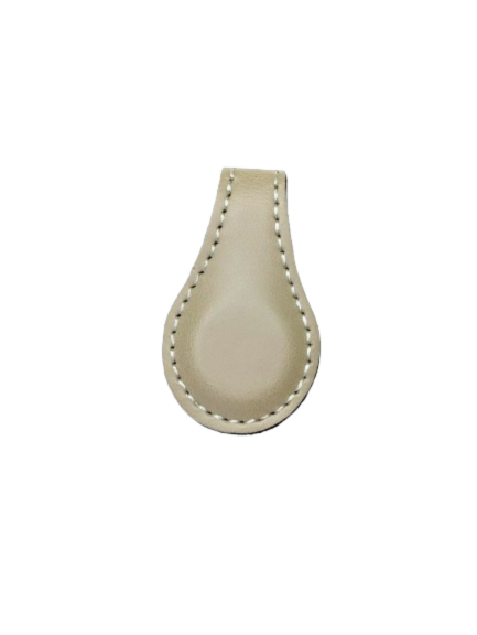 Beige leatherette magnetic bookmark with a stitched edge, shown folded over a page