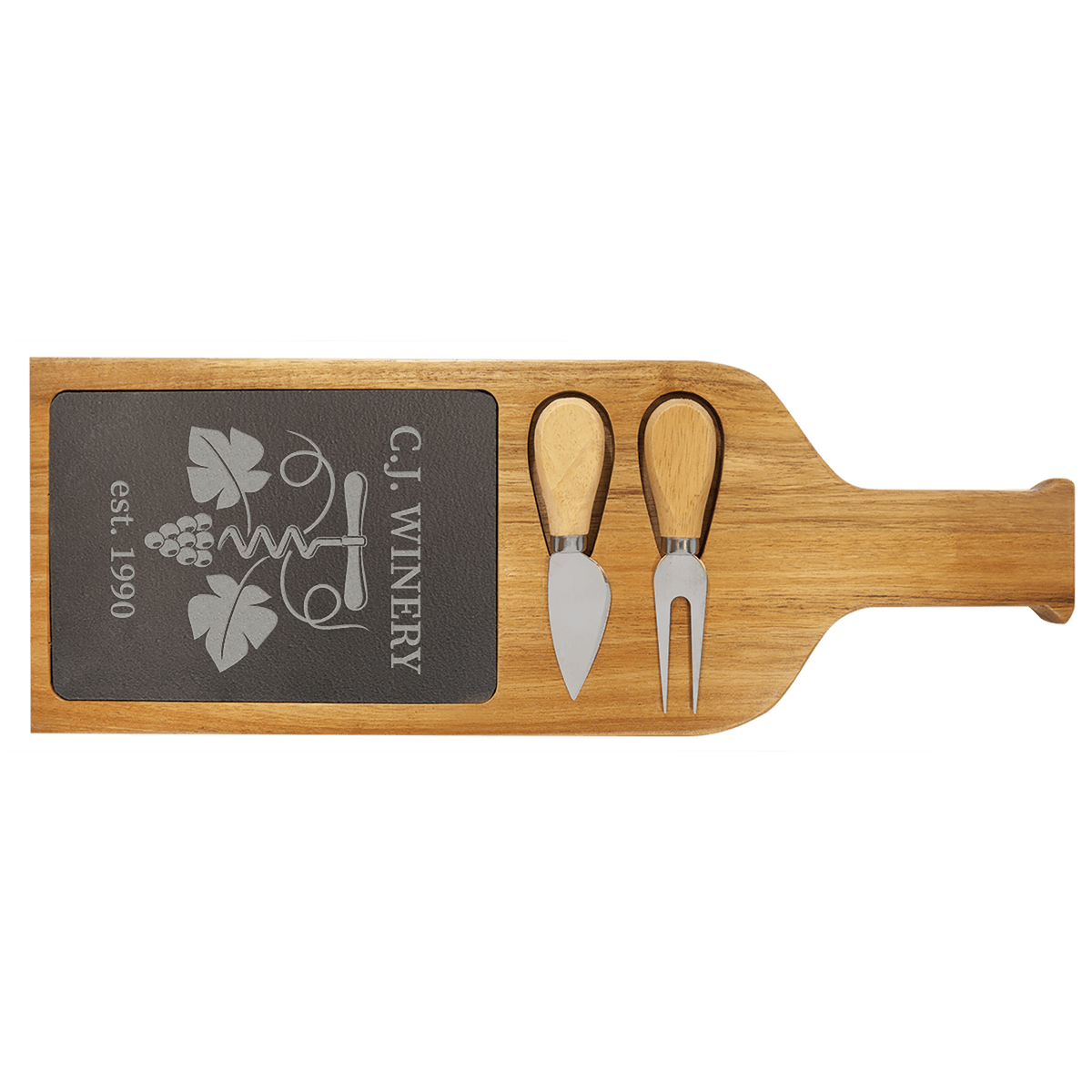 Long slate serving board framed in acacia wood with a serving fork and spreading knife in the front
