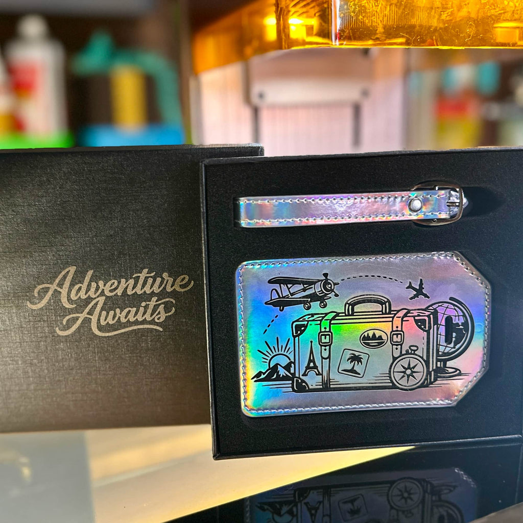 Engraved detail on a leatherette luggage tag showing the contrasting tone beneath the surface — custom engraved luggage tag by Solano Laser Craft