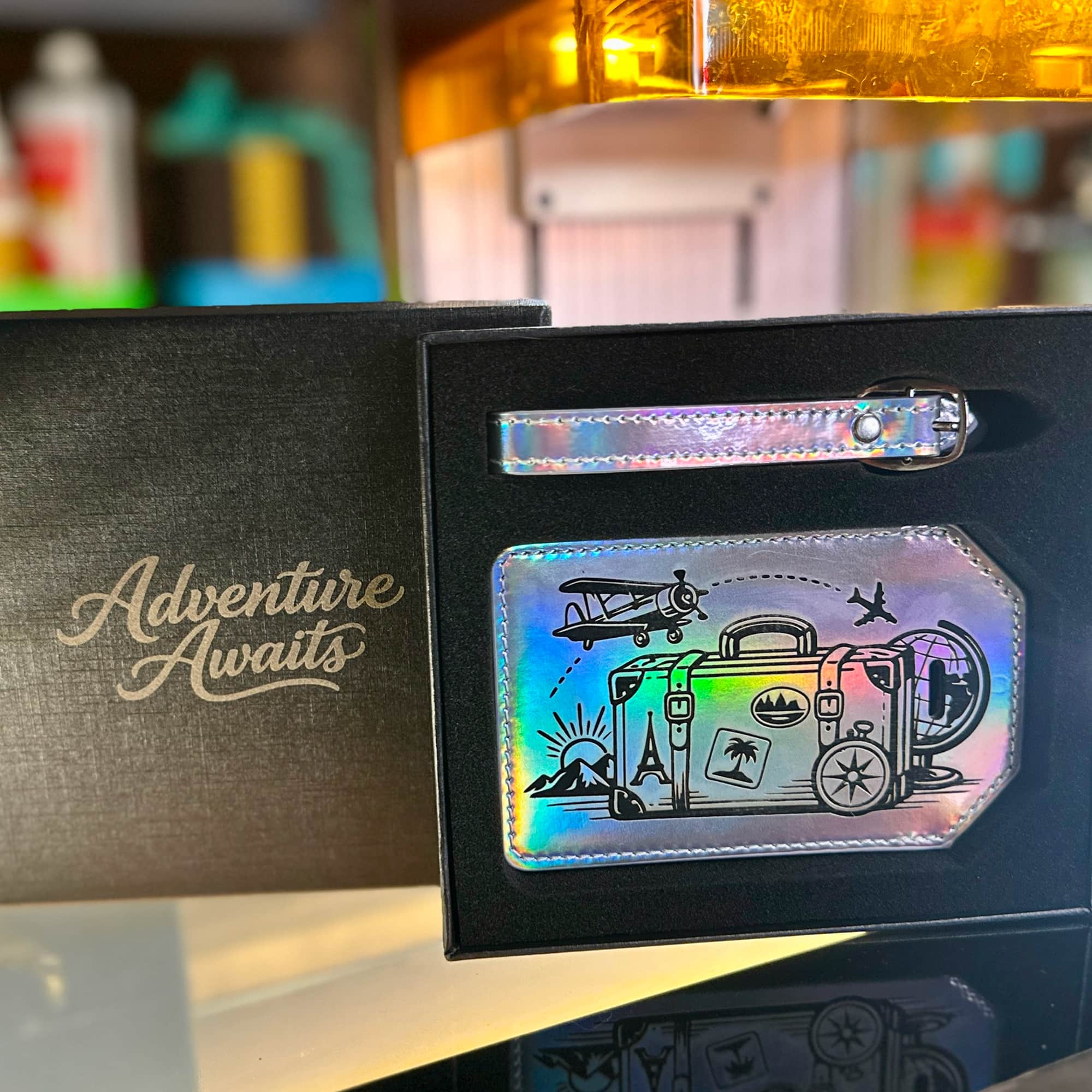 Engraved detail on a leatherette luggage tag showing the contrasting tone beneath the surface — custom engraved luggage tag by Solano Laser Craft