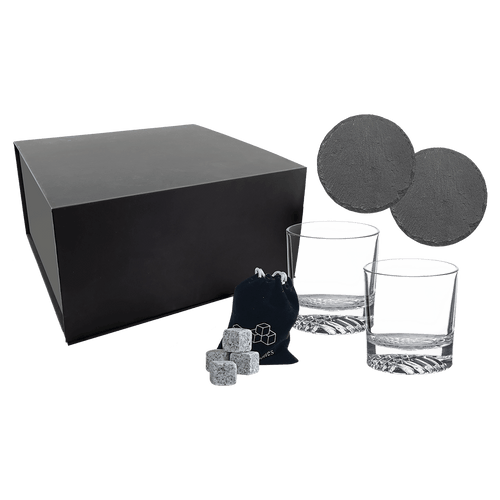 Whiskey gift set with two rocks glasses, two slate coasters, granite whiskey stones and a velvet bag beside its black gift box