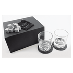 Whiskey gift set engraved with a monogram on the box lid and both rocks glasses, set on slate coasters
