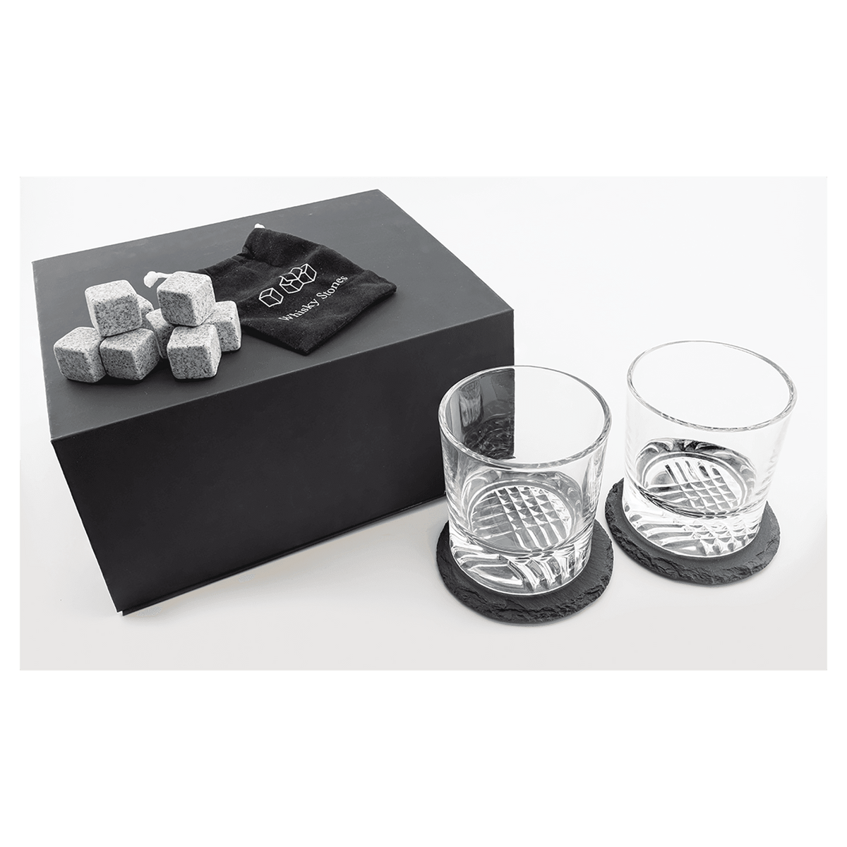 Whiskey gift set engraved with a monogram on the box lid and both rocks glasses, set on slate coasters