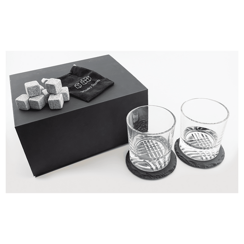 Whiskey gift set engraved with a monogram on the box lid and both rocks glasses, set on slate coasters