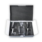Whiskey decanter with four rocks glasses in a black foam-lined presentation case