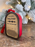 Baby Monitor ornament wrapped in Ruby leatherette, engraved for a baby's first Christmas