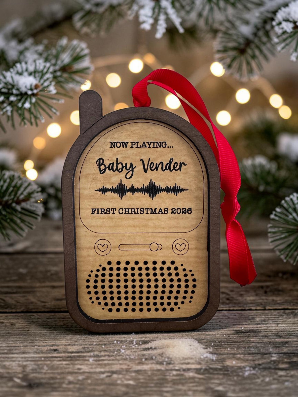 Baby Monitor recordable ornament engraved Now Playing, a baby's name and First Christmas 2026, with a sound wave and red ribbon
