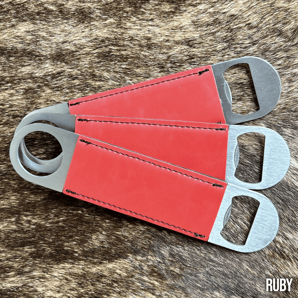 Three stainless steel bar bottle openers wrapped in Ruby red Premium Leatherette, fanned out to show the wrap and the opener end.