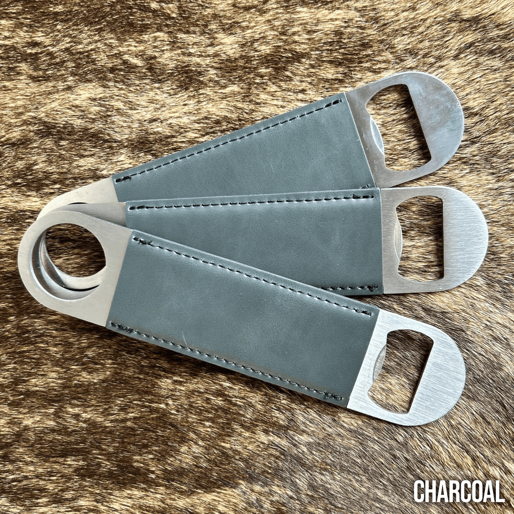 Three stainless steel bar bottle openers wrapped in Charcoal grey Premium Leatherette, fanned out to show the wrap and the opener end.