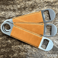 Three stainless steel bar bottle openers wrapped in Buckskin tan Premium Leatherette, fanned out to show the wrap and the opener end.