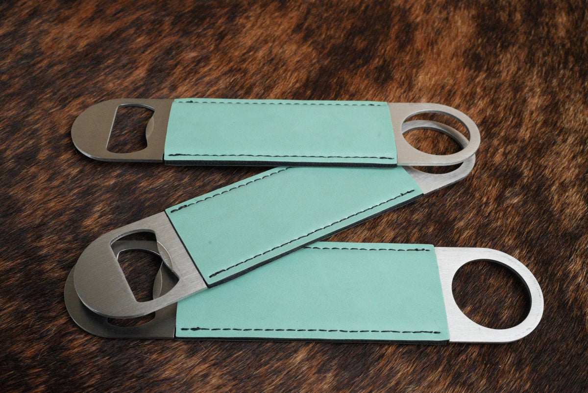 Three stainless steel bar bottle openers wrapped in Seafoam Green Premium Leatherette, fanned out to show the wrap and the opener end.