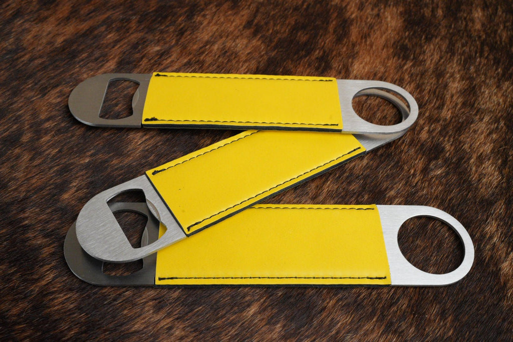 Three stainless steel bar bottle openers wrapped in Yellow Premium Leatherette, fanned out to show the wrap and the opener end.