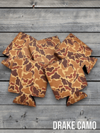 Drake Camo Premium Leatherette can coolers in a duck camouflage pattern, laid flat and collapsed.