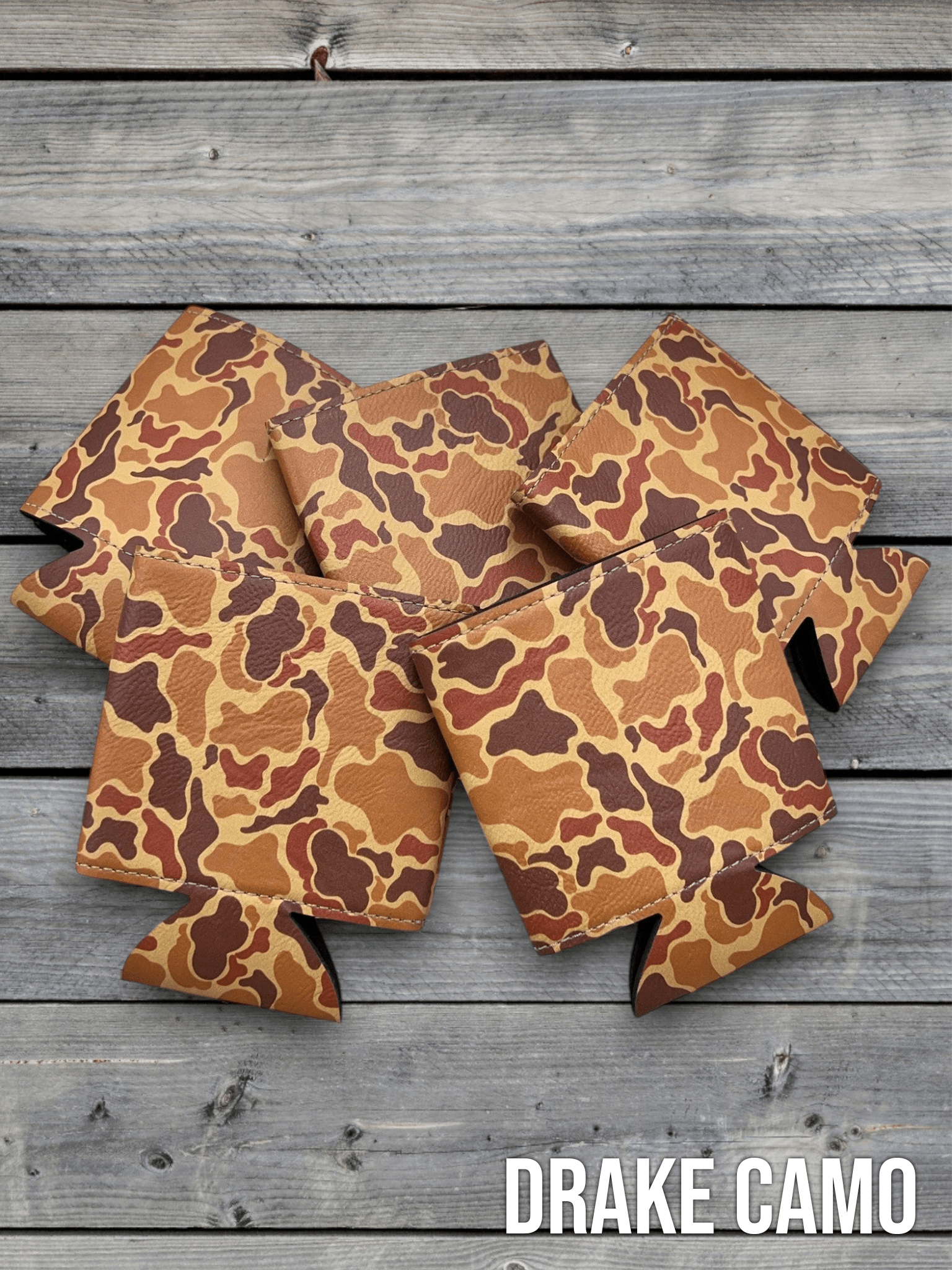 Drake Camo Premium Leatherette can coolers in a duck camouflage pattern, laid flat and collapsed.