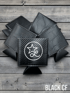 Black carbon fiber Premium Leatherette can coolers with a woven texture, shown folded on a cowhide surface.
