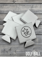 Golf Ball texture Premium Leatherette can coolers with a dimpled white surface, laid flat and collapsed.