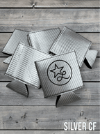 Silver carbon fiber Premium Leatherette can coolers with a woven texture, shown folded on a cowhide surface.