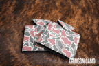 Crimson Camo Premium Leatherette can coolers in a red camouflage pattern, laid flat and collapsed.
