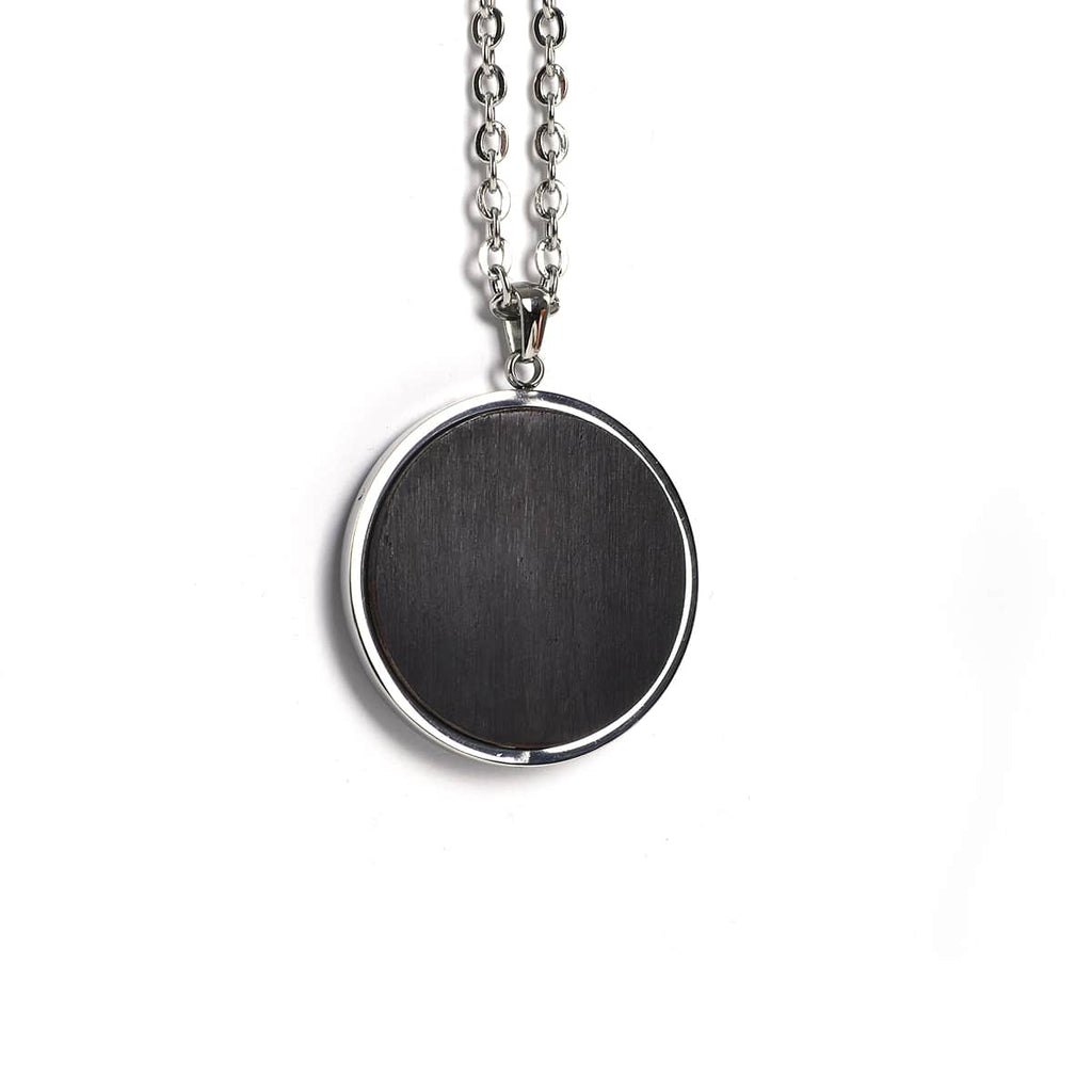 Round pendant in black African blackwood on a stainless steel chain