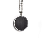 Round pendant in black African blackwood on a stainless steel chain