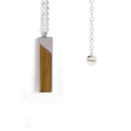 Vertical bar pendant in natural wood on a stainless steel chain